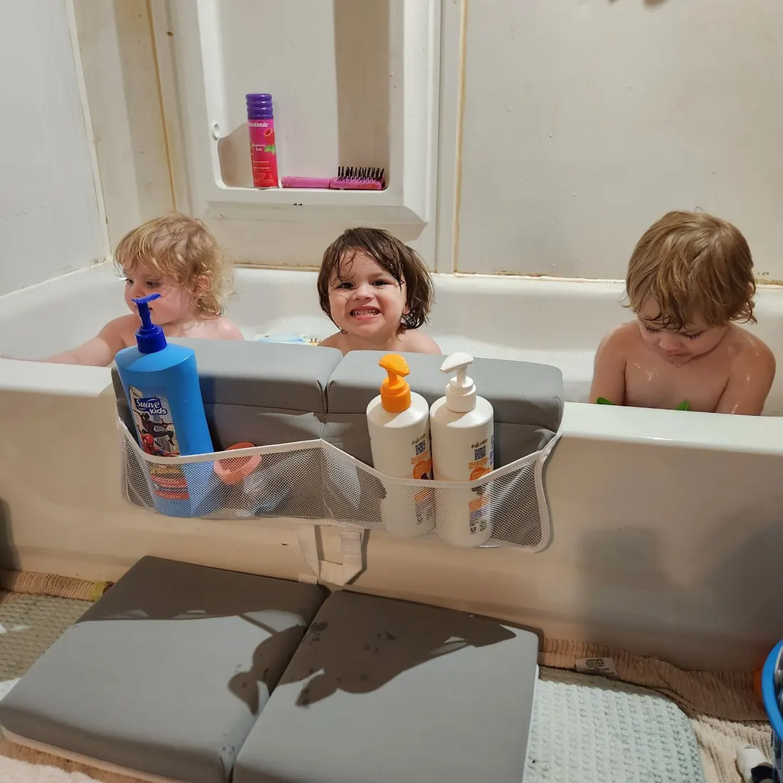 FluffyTub bath kneeler in use beside a bathtub